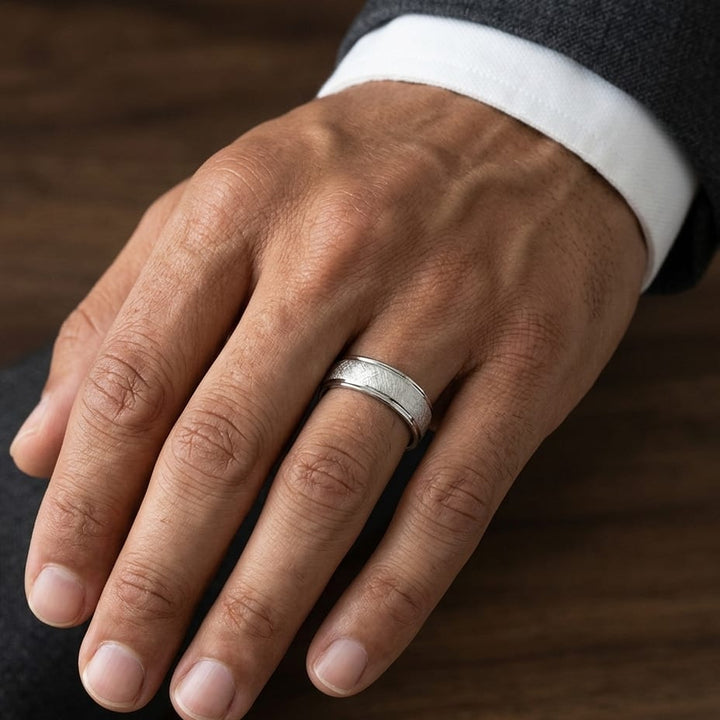 6.5mm Round Edge Swirl Finish Carved Wedding Band in 18K White Gold, worn on hand, masculine close-up