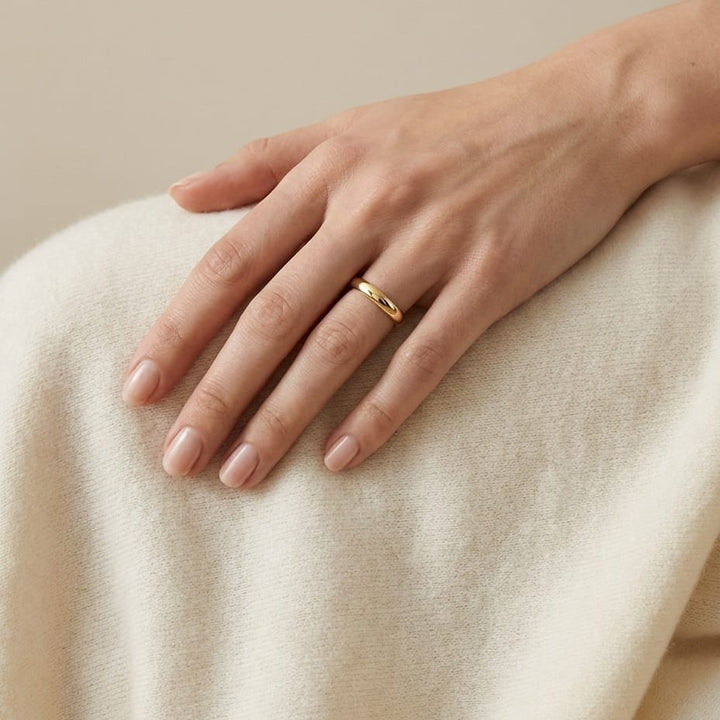 3mm Slightly Domed Traditional Oval Wedding Band in 18K Yellow Gold, worn on hand, full view