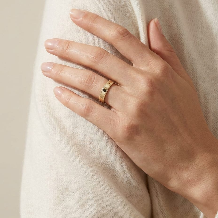 4mm Flat Milgrain Comfort-Fit Wedding Band in 18K Yellow Gold, worn on hand, full view