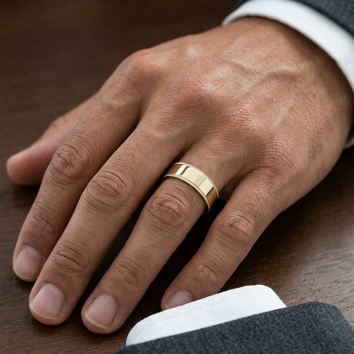 8mm Flat Milgrain Comfort-Fit Wedding Band in 18K Yellow Gold, worn on hand, masculine close-up