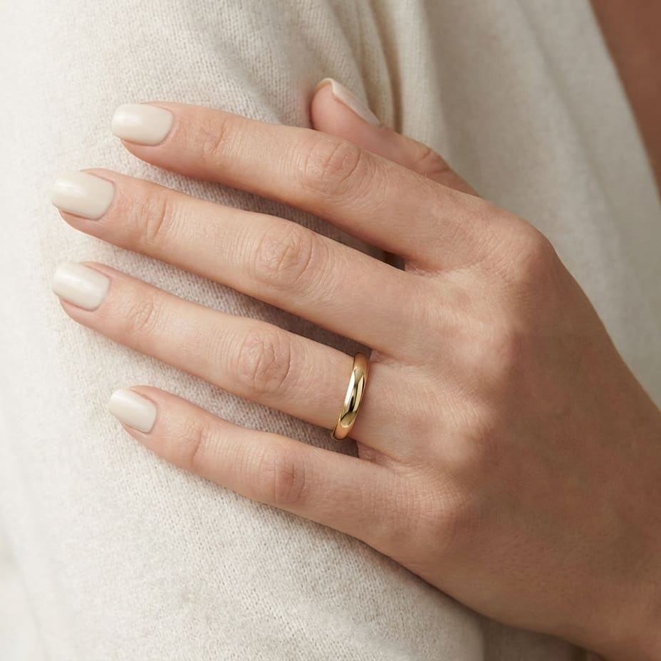 3mm High Dome Comfort-Fit Wedding Band in 18K Yellow Gold, worn on hand, close-up