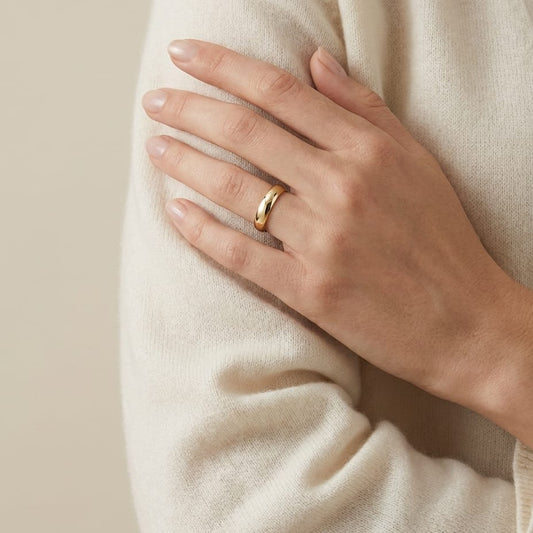 4mm Slightly Domed Comfort-Fit Wedding Band in 18K Yellow Gold, worn on hand, full view