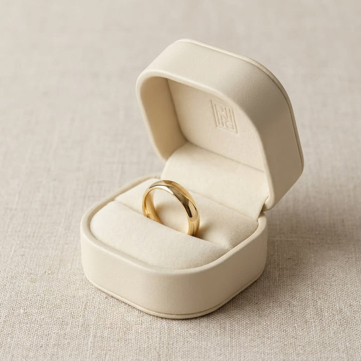 4mm Slightly Domed Comfort-Fit Wedding Band in 18K Yellow Gold, in navy velvet jewelry box