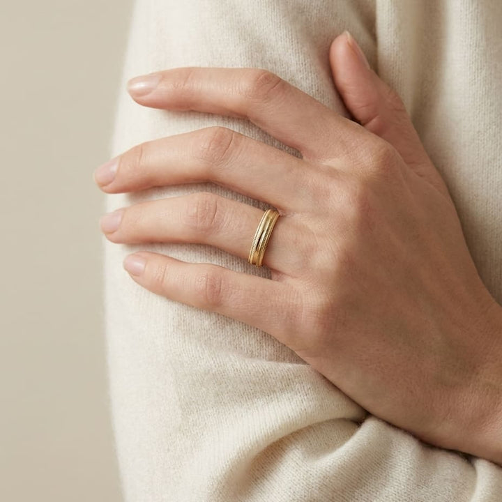 4mm Slightly Domed Double Milgrain Comfort-Fit Wedding Band in 18K Yellow Gold, worn on hand, full view