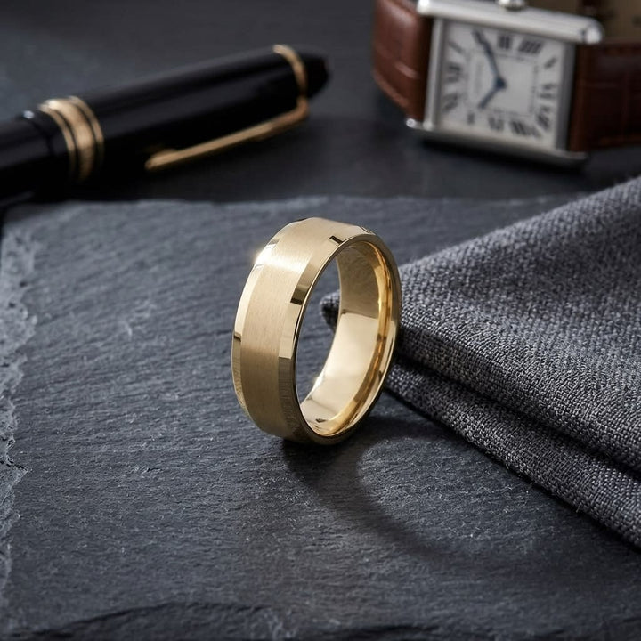 7mm Satin Finish High Polished Beveled Edge Carved Wedding Band in 18K Yellow Gold, on walnut surface with pocket square