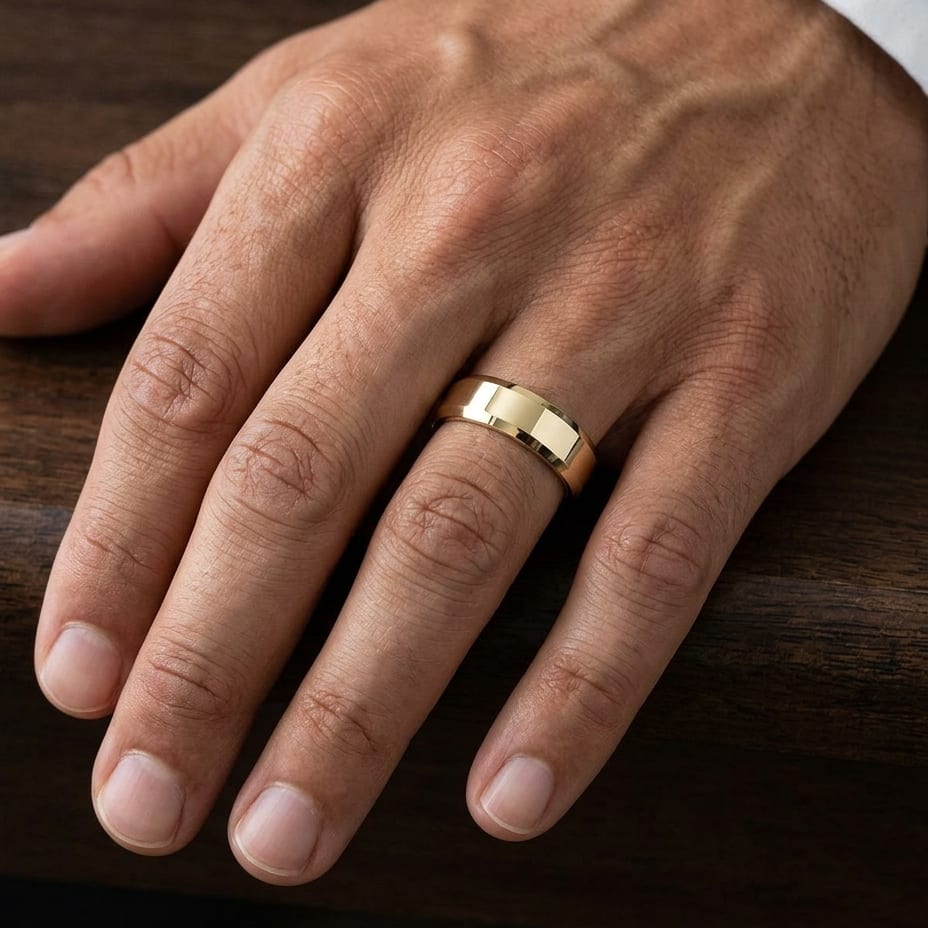 6mm High Polish Carved Wedding Band in 18K Yellow Gold, worn on hand, masculine close-up
