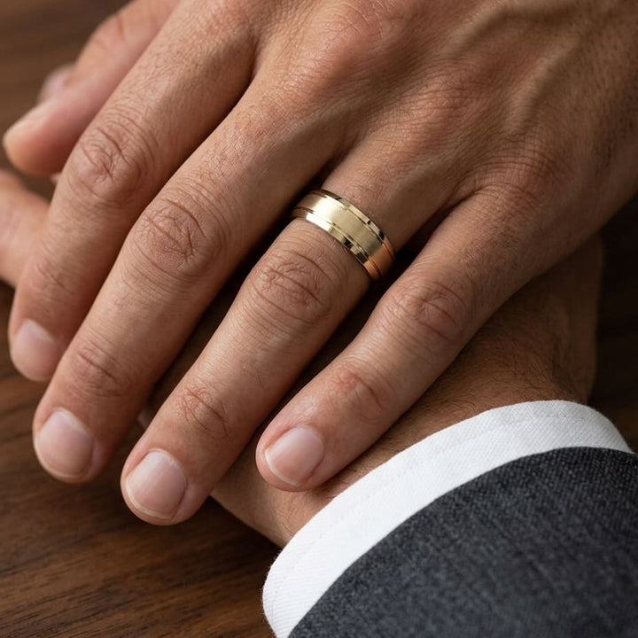 6mm Satin Finish High Polished Beveled Edge Carved Wedding Band in 18K Yellow Gold, worn on hand, masculine close-up