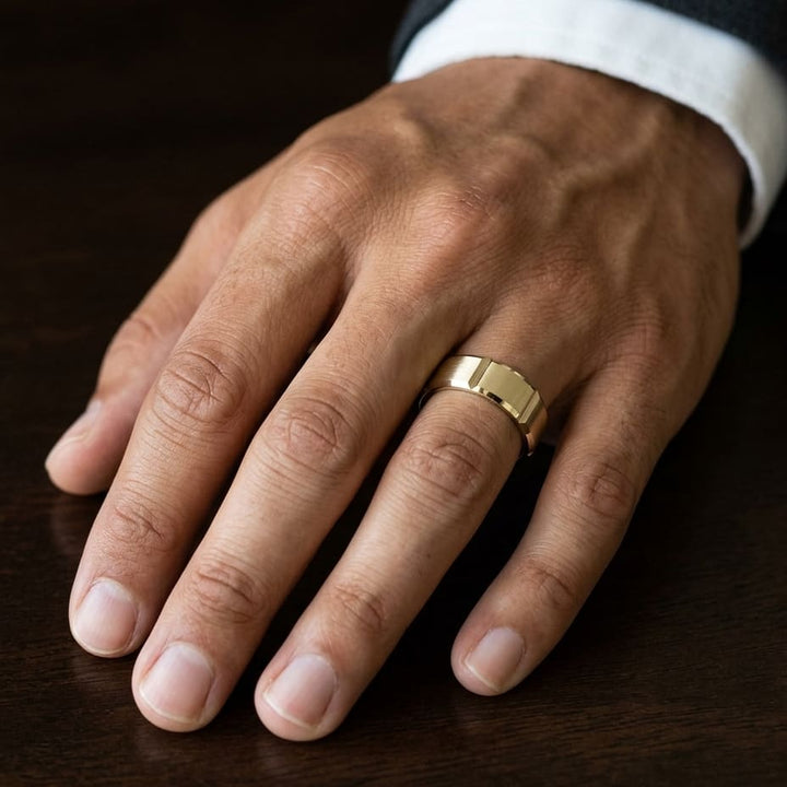 6mm Satin Finish Grooves Carved Wedding Band in 18K Yellow Gold, worn on hand, masculine close-up