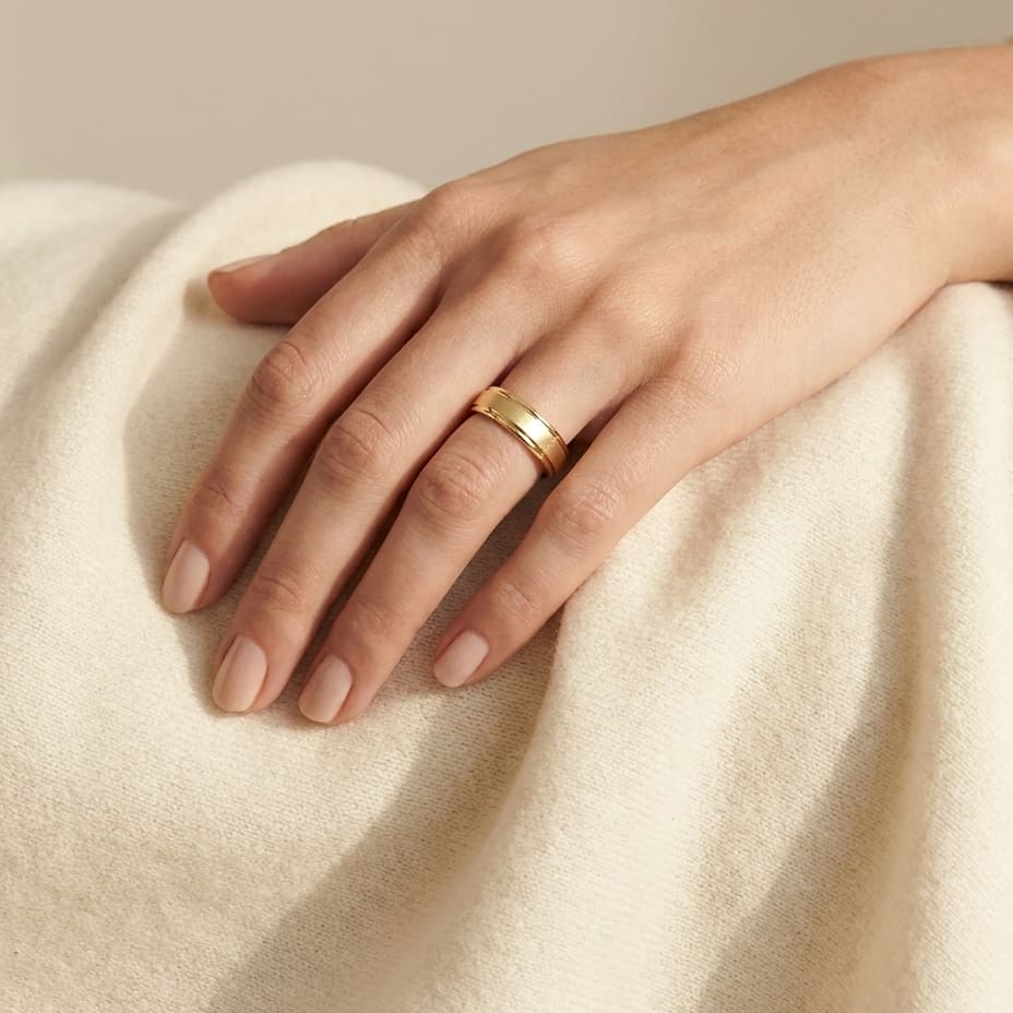 4mm Wired Finish High Polished Round Edge Carved Wedding Band in 18K Yellow Gold, worn on hand, full view