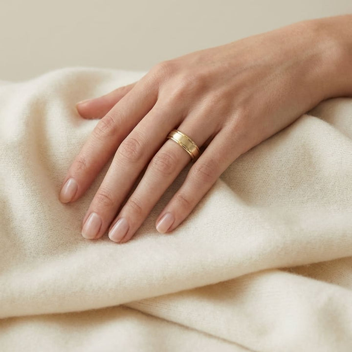 4mm Satin Finish High Polished Round Edge Carved Wedding Band in 18K Yellow Gold, worn on hand, full view