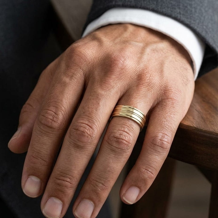 8mm Satin Finish High Polished Center Trim Carved Wedding Band in 18K Yellow Gold, worn on hand, masculine close-up