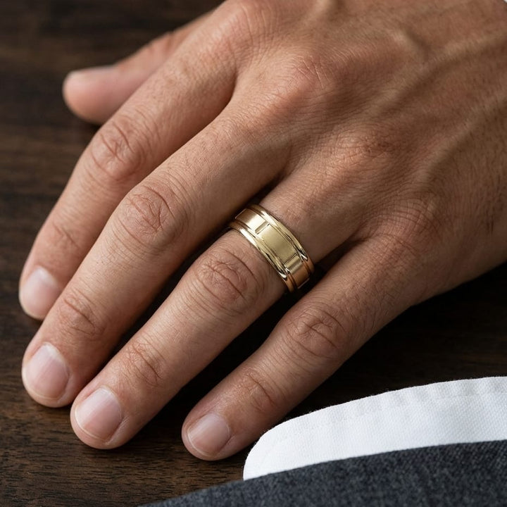 6mm Satin Finish High Polished Center Cut Carved Wedding Band in 18K Yellow Gold, worn on hand, masculine close-up