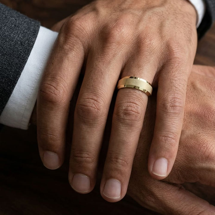 7mm High Polish Cross Hatch Center Carved Wedding Band in 18K Yellow Gold, worn on hand, masculine close-up
