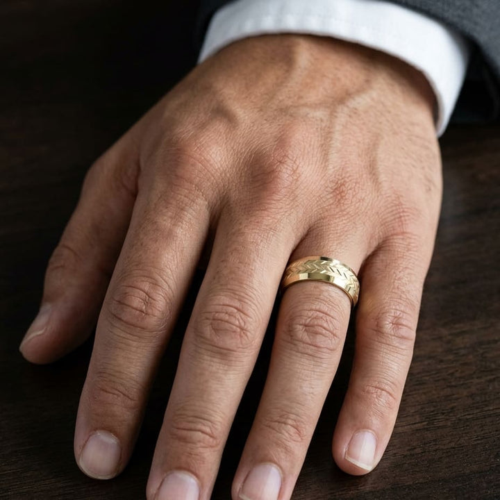 8mm Beveled Edge Treaded Carved Wedding Band in 18K Yellow Gold, worn on hand, masculine close-up