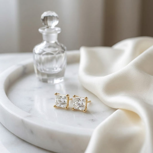18k Yellow Gold 4-prong Princess Diamond Stud Earrings (0.52 Ct. T.w., Vs1-vs2 Clarity, F-g Color), on marble vanity tray with silk