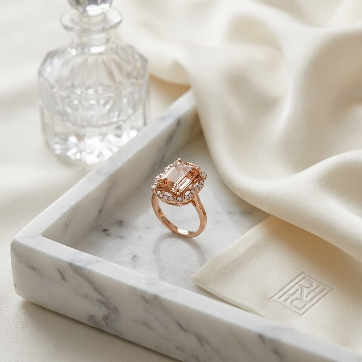 Emerald Cut Morganite Scalloped Framed Ring 14k Rose Gold 0.14ctw, on marble vanity tray with silk