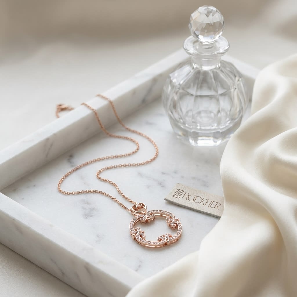 Natural Diamond Round Brilliant Pendant in 14K Rose Gold, on marble vanity tray with silk
