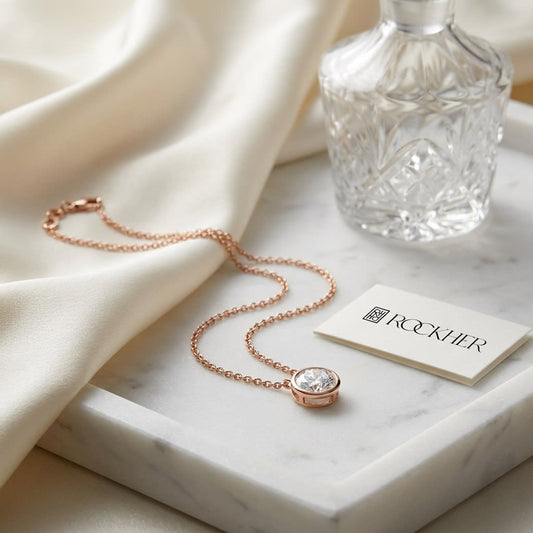 Natural Diamond Round Brilliant Solitaire Pendant in 14K Rose Gold, 2 ct. t.w., on marble vanity tray with silk
