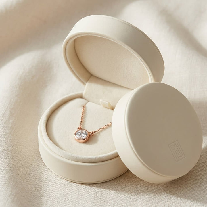 Natural Diamond Round Brilliant Solitaire Pendant in 14K Rose Gold, 1 ct. t.w., in navy velvet jewelry box