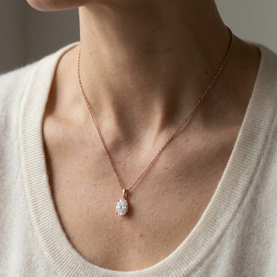 Natural Diamond Oval Solitaire Pendant in 14K Rose Gold, 4 ct. t.w., worn close-up portrait