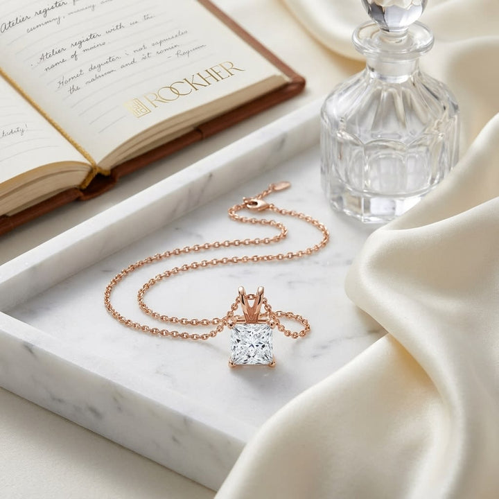 Natural Diamond Princess Cut Solitaire Pendant in 14K Rose Gold, 4 ct. t.w., on marble vanity tray with silk