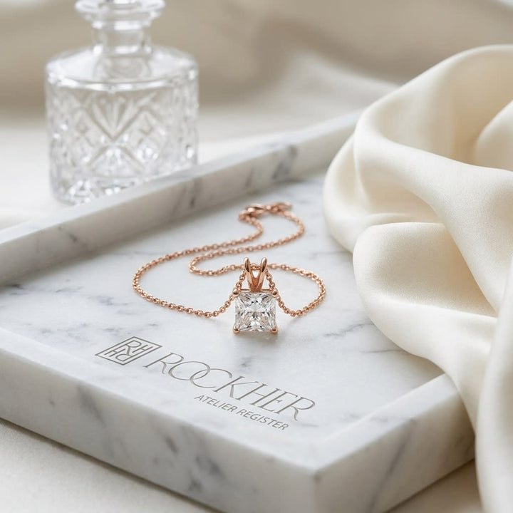 Natural Diamond Princess Cut Solitaire Pendant in 14K Rose Gold, 4 ct. t.w., on marble vanity tray with silk