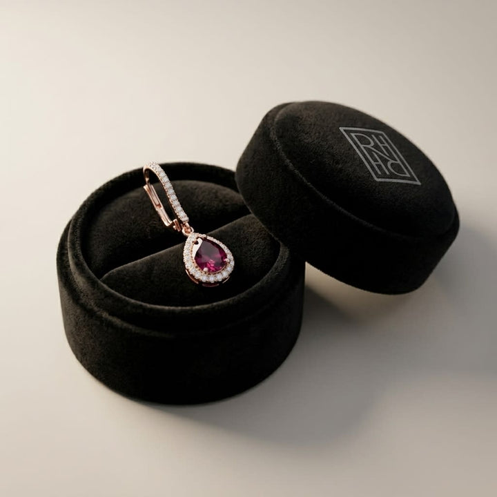 Rhodolite Garnet And Diamond Teardrop Halo Dangling Earrings in 14K Rose Gold, in navy velvet jewelry box