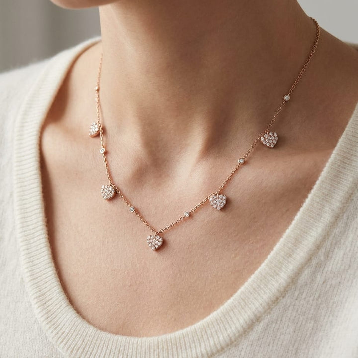 Diamond Pave Dangling 5-heart Station Necklace in 14K Rose Gold, 16-18 Adj Chn, worn close-up portrait