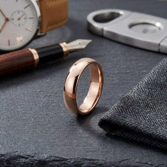 5mm Slightly Domed Traditional Oval Wedding Band in 14K Rose Gold, on walnut surface with pocket square