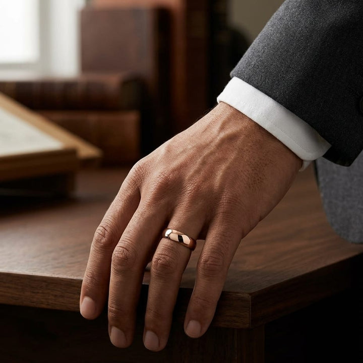 6mm Slightly Domed Traditional Oval Wedding Band in 14K Rose Gold, worn on hand, masculine full view