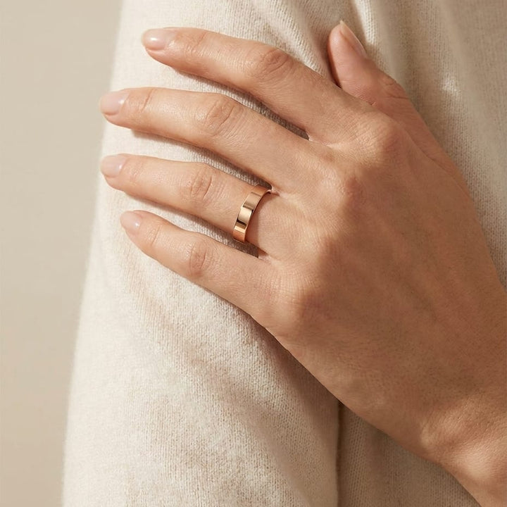 4mm Flat Comfort-Fit Wedding Band in 14K Rose Gold, worn on hand, full view