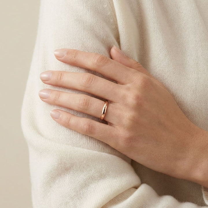 2.5mm Slightly Domed Comfort-Fit Wedding Band in 14K Rose Gold, worn on hand, full view