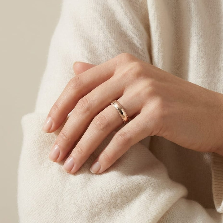 4mm Slightly Domed Milgrain Comfort-Fit Wedding Band in 14K Rose Gold, worn on hand, full view