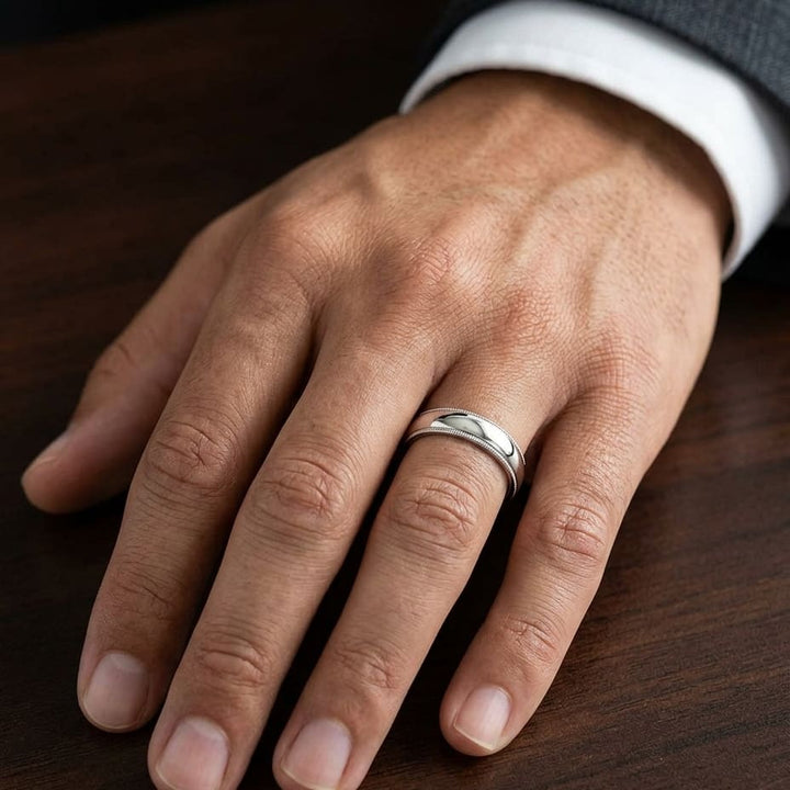 5mm Slightly Domed Milgrain Comfort-Fit Wedding Band in 14K Rose Gold, worn on hand, masculine close-up