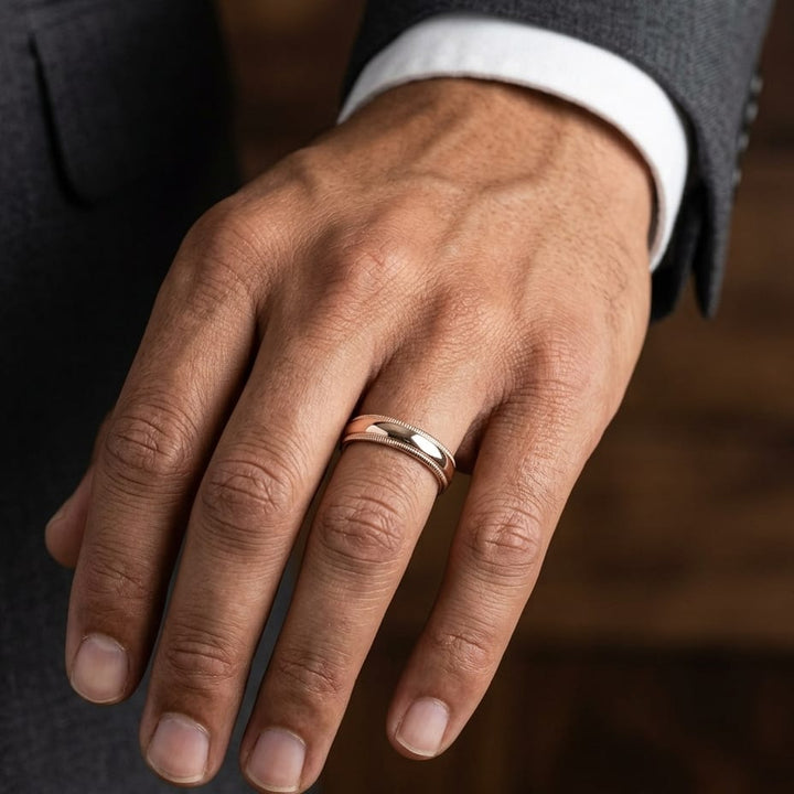 5mm Slightly Domed Double Milgrain Comfort-Fit Wedding Band in 14K Rose Gold, worn on hand, masculine close-up