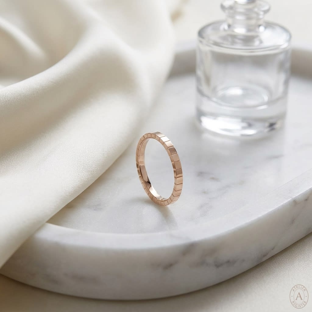 2mm High Polish Carved Wedding Band in 14K Rose Gold, on marble vanity tray with silk