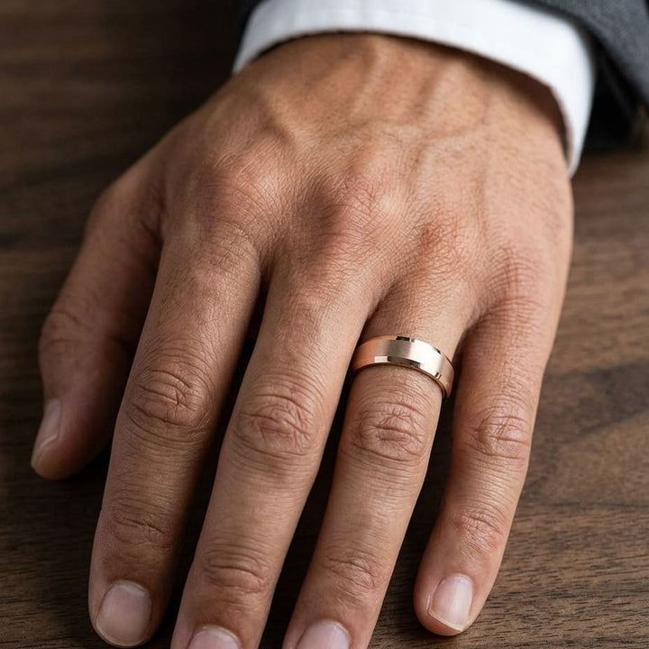 7mm Satin Finish High Polished Beveled Edge Carved Wedding Band in 14K Rose Gold, worn on hand, masculine close-up