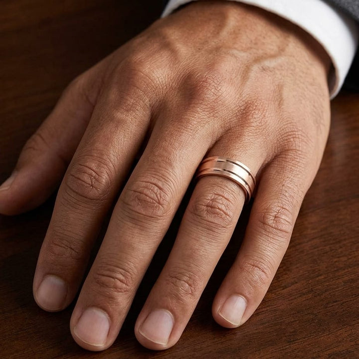 8mm Satin Finish Parallel Groove Carved Wedding Band in 14K Rose Gold, worn on hand, masculine close-up