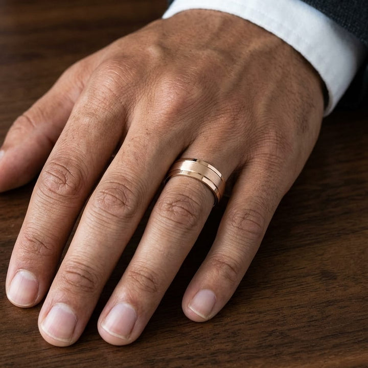7mm Satin Finish High Polished Beveled Edge Carved Wedding Band in 14K Rose Gold, worn on hand, masculine close-up