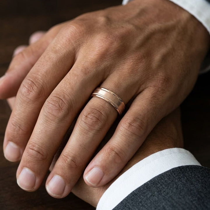 6mm Satin Finish Milgrain Round Edge Carved Wedding Band in 14K Rose Gold, worn on hand, masculine close-up