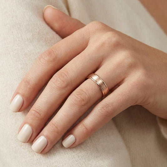 4mm Satin Finish High Polished Round Edge Carved Wedding Band in 14K Rose Gold, worn on hand, close-up