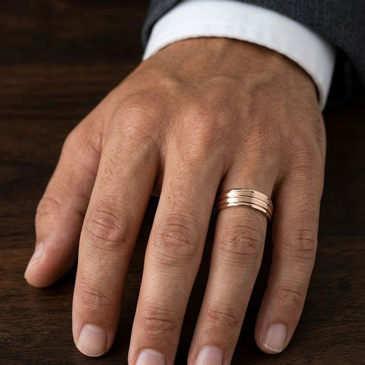 6mm Satin Finish High Polished Center Trim Carved Wedding Band in 14K Rose Gold, worn on hand, masculine close-up