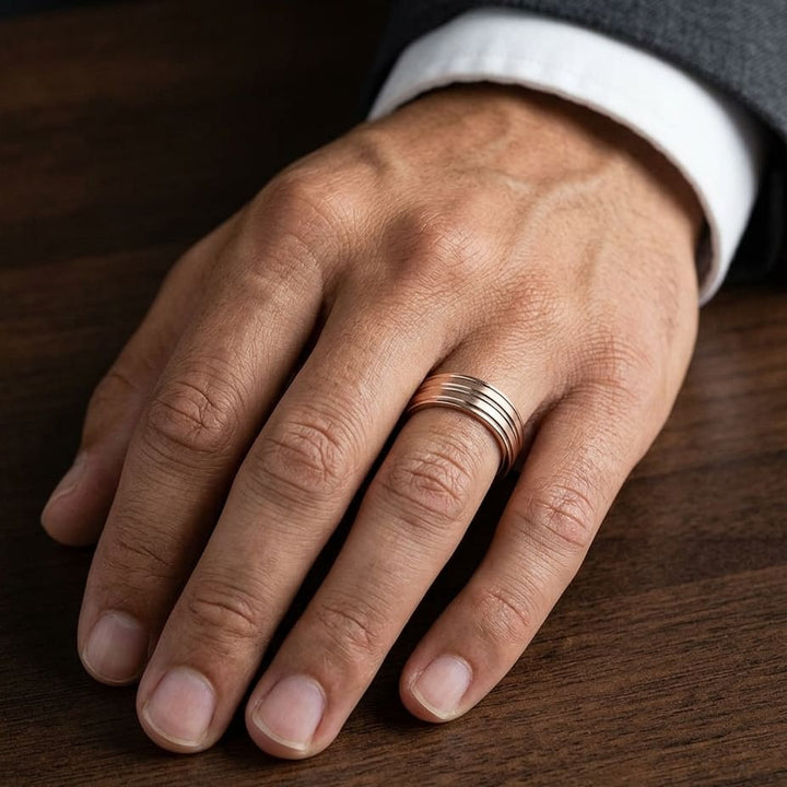 8mm Satin Finish High Polished Center Trim Carved Wedding Band in 14K Rose Gold, worn on hand, masculine close-up