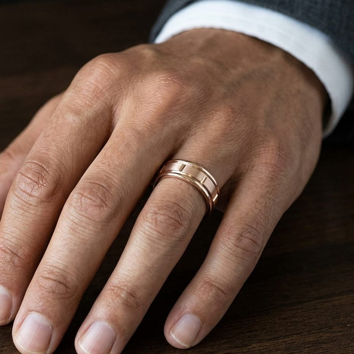 6mm Satin Finish High Polished Center Cut Carved Wedding Band in 14K Rose Gold, worn on hand, masculine close-up