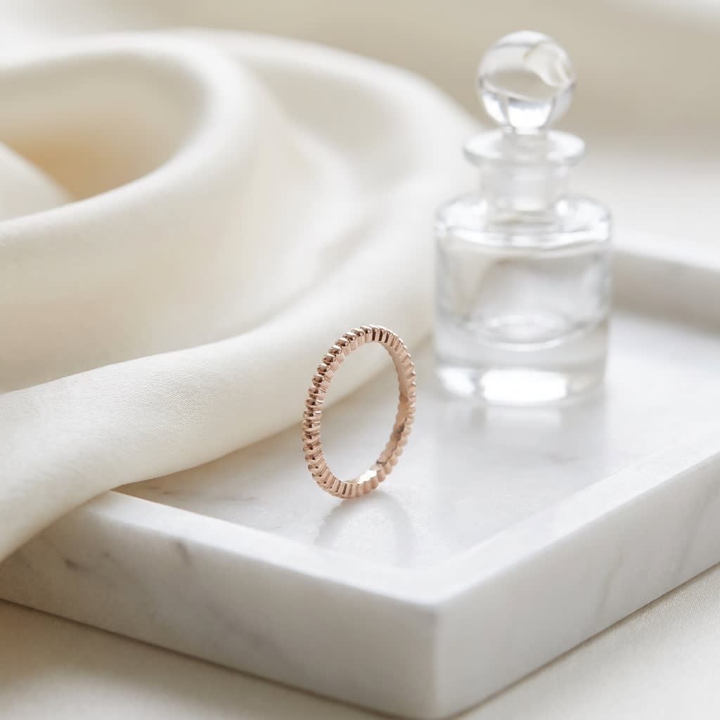2mm Comfort-Fit Wedding Band in 14K Rose Gold, on marble vanity tray with silk