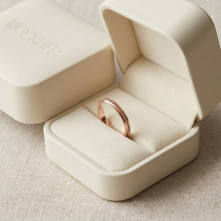 2mm High Polish Milgrain Round Edge Carved Wedding Band in 14K Rose Gold, in navy velvet jewelry box