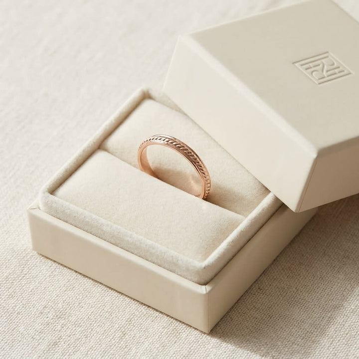 2mm High Polish Carved Wedding Band in 14K Rose Gold, in navy velvet jewelry box