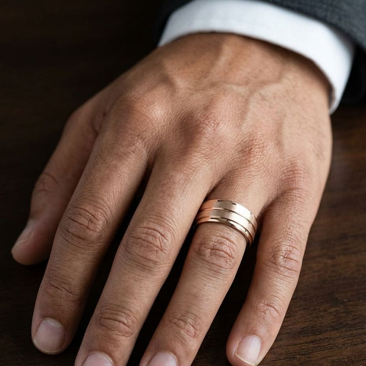 8mm Satin Finish High Polished Center Cut Carved Wedding Band in 14K Rose Gold, worn on hand, masculine close-up