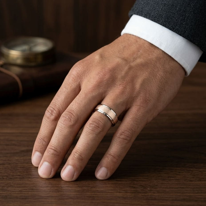7mm Round Edge Swirl Finish Carved Wedding Band in 14K Rose Gold, worn on hand, masculine full view