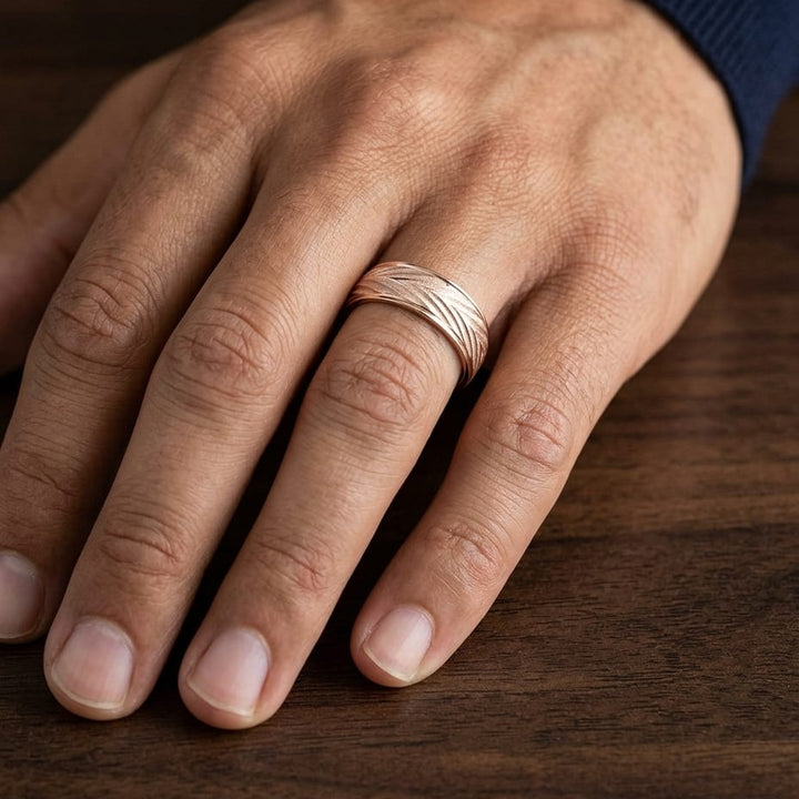 7mm Comfort-Fit Wedding Band in 14K Rose Gold, worn on hand, masculine close-up